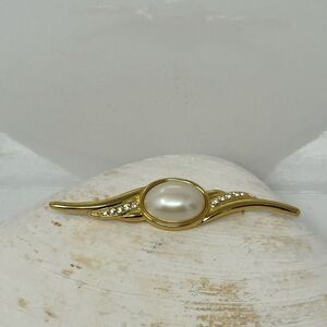 Golden pearl brooch with clear stones signed Monet
